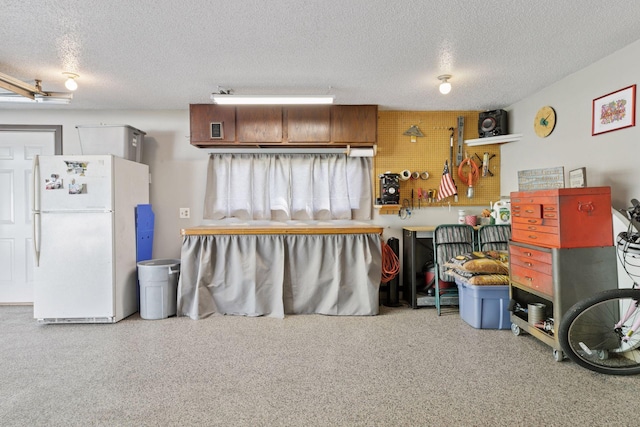 garage featuring freestanding refrigerator