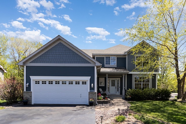 view of front of house featuring concrete driveway and an attached garage