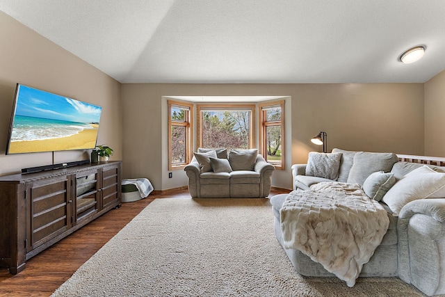 living room with baseboards and dark wood finished floors