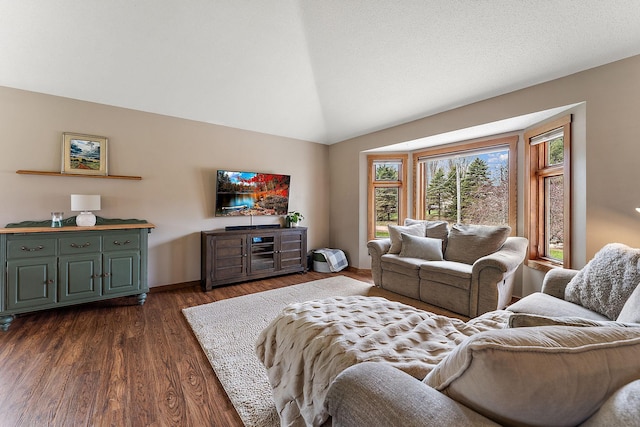 living room featuring dark wood-type flooring, baseboards, and vaulted ceiling