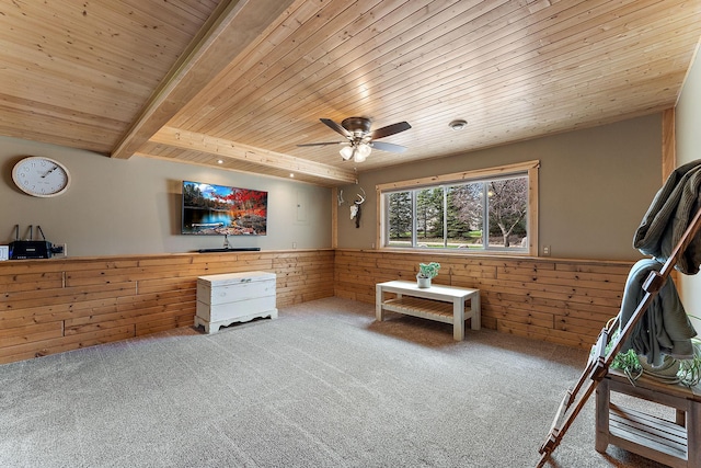bedroom featuring wood ceiling, a wainscoted wall, wood walls, and carpet floors