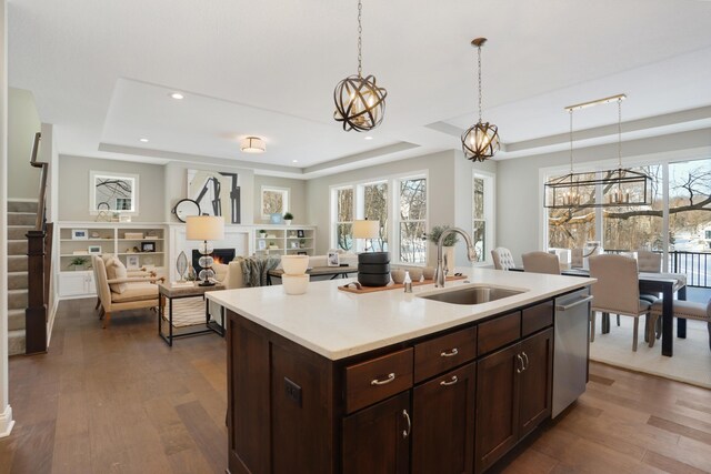 3338 Winfield Way SW, Prior Lake, MN 55372 - kitchen featuring light countertops, a tray ceiling, dark wood finished floors, and a sink