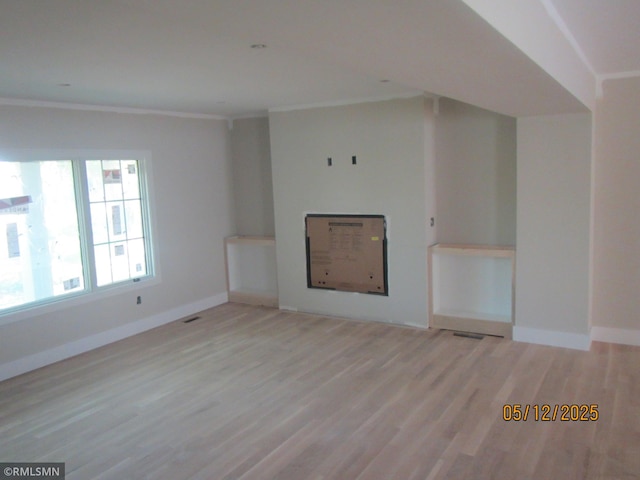 1255 78th St, Victoria, MN 55386 - unfurnished living room with light wood finished floors, ornamental molding, and baseboards