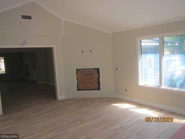 1255 78th St, Victoria, MN 55386 - spare room featuring healthy amount of natural light, wood finished floors, baseboards, and lofted ceiling