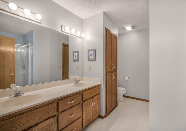 9967 Egret Blvd NW, Coon Rapids, MN 55433 - full bath with a textured ceiling, double vanity, a shower stall, toilet, and baseboards