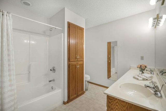 9967 Egret Blvd NW, Coon Rapids, MN 55433 - full bath featuring toilet, tile patterned floors, shower / bathtub combination with curtain, a textured ceiling, and double vanity