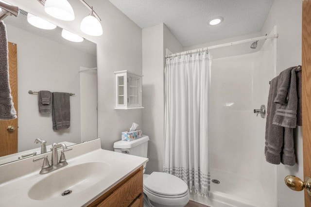 9967 Egret Blvd NW, Coon Rapids, MN 55433 - bathroom featuring curtained shower, toilet, vanity, and a textured ceiling