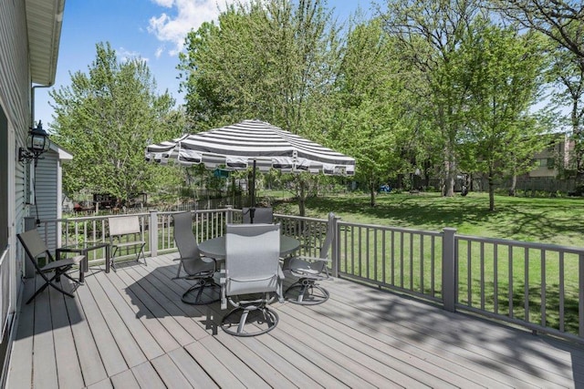 9967 Egret Blvd NW, Coon Rapids, MN 55433 - deck with outdoor dining space and a yard