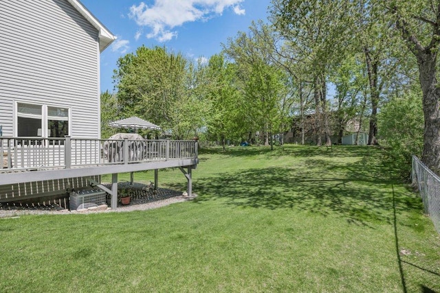 9967 Egret Blvd NW, Coon Rapids, MN 55433 - view of yard featuring a deck and central AC