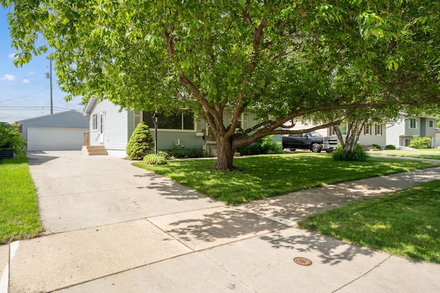 3618 1st St NW, Rochester, MN 55901 - obstructed view of property with an outbuilding, a front yard, a garage, and entry steps