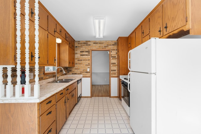 3618 1st St NW, Rochester, MN 55901 - kitchen with white appliances, light countertops, brown cabinets, and light tile patterned flooring