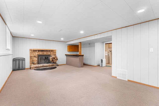 3618 1st St NW, Rochester, MN 55901 - unfurnished living room with recessed lighting, carpet floors, and a brick fireplace