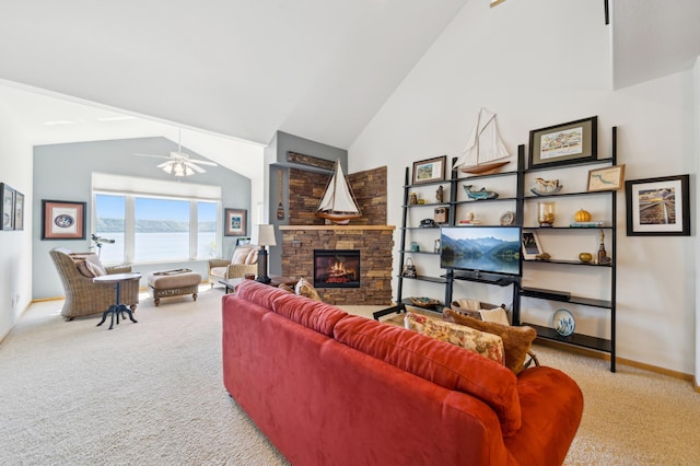 carpeted living area with a ceiling fan, baseboards, a stone fireplace, and high vaulted ceiling