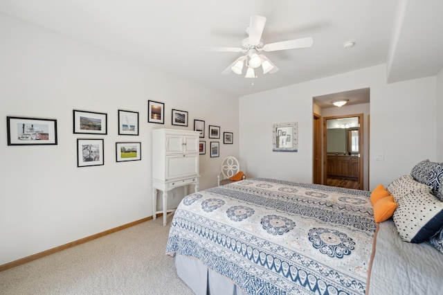 carpeted bedroom with baseboards and a ceiling fan