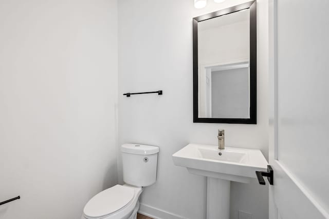 half bath featuring toilet