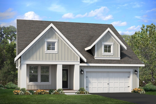 modern inspired farmhouse with board and batten siding, roof with shingles, driveway, and a front lawn