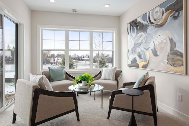 sitting room with carpet flooring, recessed lighting, and a wealth of natural light