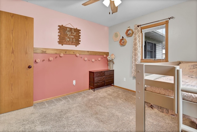 bedroom with carpet flooring, a ceiling fan, and baseboards