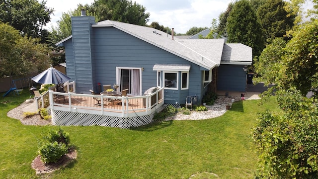 5634 142nd St W, Apple Valley, MN 55124 - rear view of house with a wooden deck, a chimney, and a shingled roof