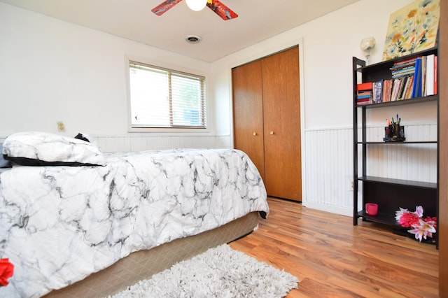 5634 142nd St W, Apple Valley, MN 55124 - bedroom with wood finished floors, a closet, and a ceiling fan
