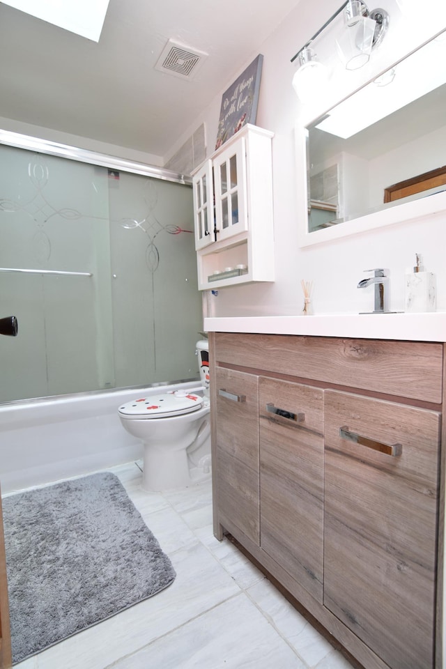 5634 142nd St W, Apple Valley, MN 55124 - bathroom with vanity, toilet, combined bath / shower with glass door, and marble finish floors