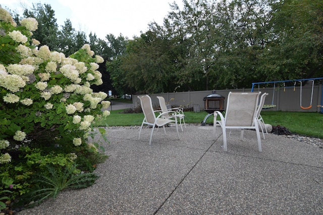 5634 142nd St W, Apple Valley, MN 55124 - view of patio / terrace featuring a playground and view of scattered trees