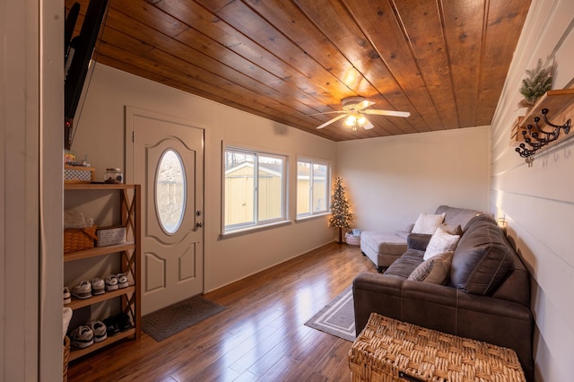 foyer with wood ceiling, a ceiling fan, and wood finished floors