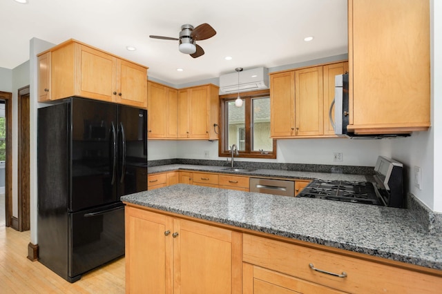 1287 Avon St N, Saint Paul, MN 55117 - kitchen featuring appliances with stainless steel finishes, a sink, ceiling fan, dark stone countertops, and a wall mounted AC