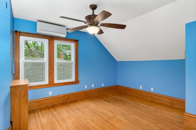 1287 Avon St N, Saint Paul, MN 55117 - bonus room with an AC wall unit, wood finished floors, lofted ceiling, baseboards, and ceiling fan