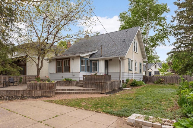 1287 Avon St N, Saint Paul, MN 55117 - view of front of home featuring a chimney, a shingled roof, a deck, and stucco siding