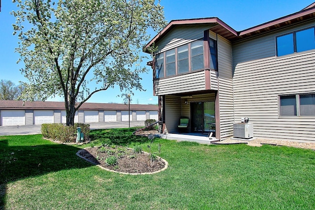 222 Sargent Dr Unit 102, Red Wing, MN 55066 - rear view of house with a yard and central AC unit