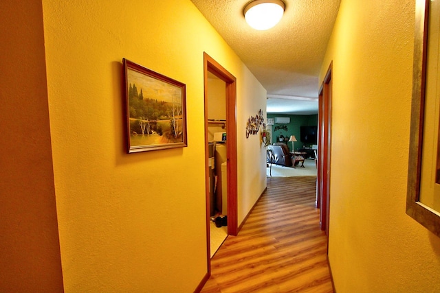 222 Sargent Dr Unit 102, Red Wing, MN 55066 - hall with a textured ceiling, a textured wall, and wood finished floors