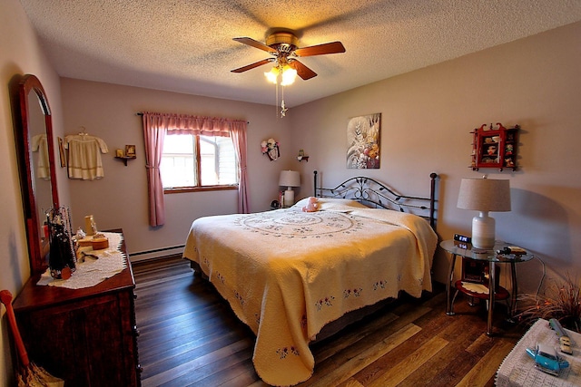 222 Sargent Dr Unit 102, Red Wing, MN 55066 - bedroom featuring dark wood-style flooring, a textured ceiling, a baseboard heating unit, and a ceiling fan