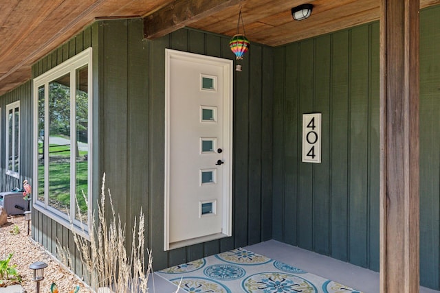 entrance to property featuring board and batten siding