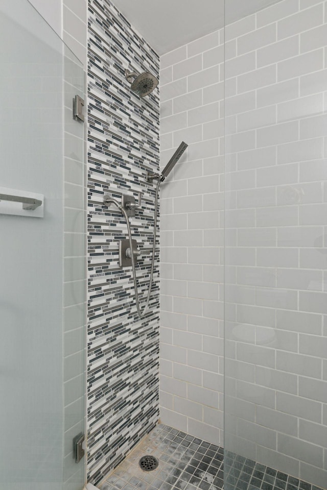 bathroom featuring a shower stall