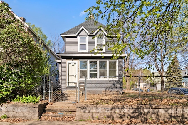1852 Quincy St NE, Minneapolis, MN 55418 - traditional-style house with a gate and fence