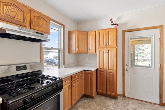 1852 Quincy St NE, Minneapolis, MN 55418 - kitchen featuring light countertops, gas stove, crown molding, and under cabinet range hood