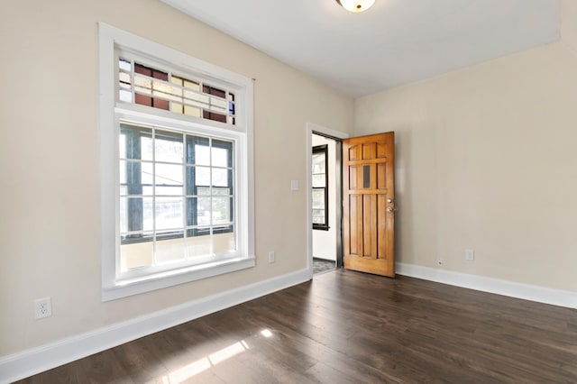 1852 Quincy St NE, Minneapolis, MN 55418 - empty room featuring baseboards and dark wood-style flooring