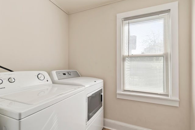 1852 Quincy St NE, Minneapolis, MN 55418 - laundry area featuring baseboards, laundry area, and washing machine and dryer