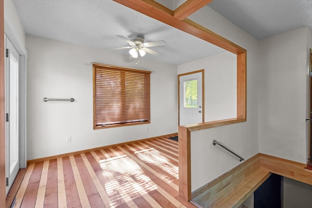 1791 Lois Dr, Shoreview, MN 55126 - unfurnished room with light wood-style flooring, ceiling fan, and baseboards