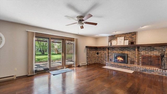 unfurnished living room featuring wood-type flooring, ceiling fan, baseboard heating, and a fireplace