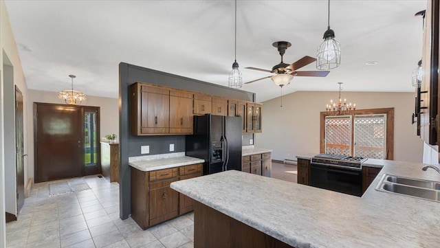 kitchen with range, black fridge with ice dispenser, a chandelier, a sink, and lofted ceiling
