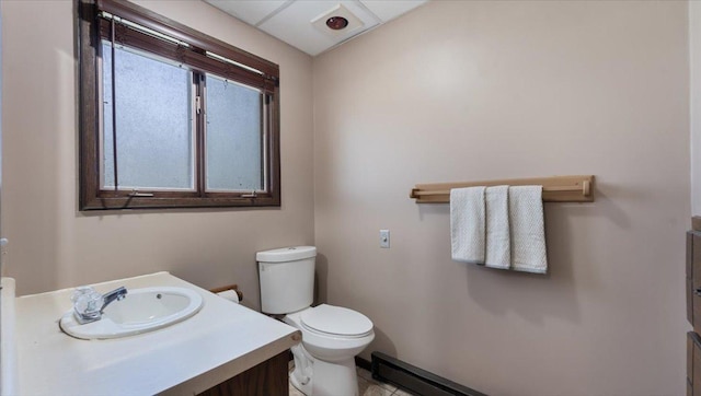 bathroom featuring toilet, vanity, and tile patterned floors