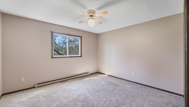 carpeted empty room featuring baseboard heating, a ceiling fan, a textured ceiling, and baseboards