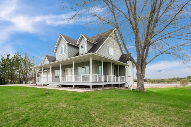 farmhouse-style home with a porch, a water view, and a front yard