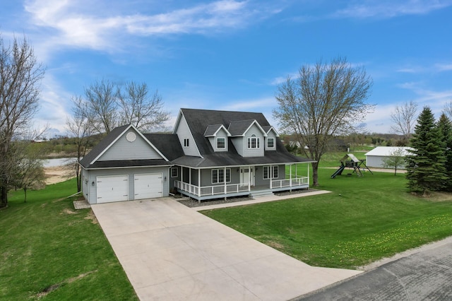 view of front of home featuring a garage, concrete driveway, a porch, and a front yard