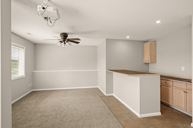 spare room with recessed lighting, a ceiling fan, a textured ceiling, and baseboards