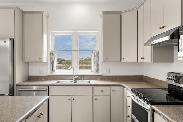 kitchen featuring a sink, light countertops, stainless steel appliances, and under cabinet range hood