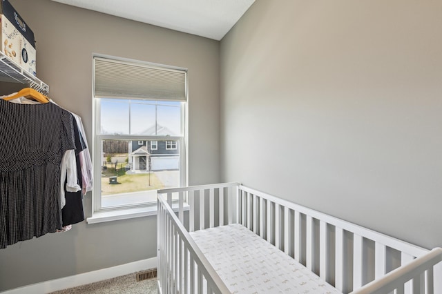 bedroom with carpet flooring, baseboards, and visible vents