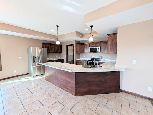 580 Canyon Ln NW, Eyota, MN 55934 - kitchen with appliances with stainless steel finishes, a sink, baseboards, dark brown cabinetry, and recessed lighting